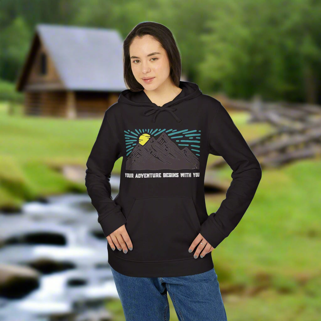 Person wearing a black hoodie with a mountain graphic and text on a white background