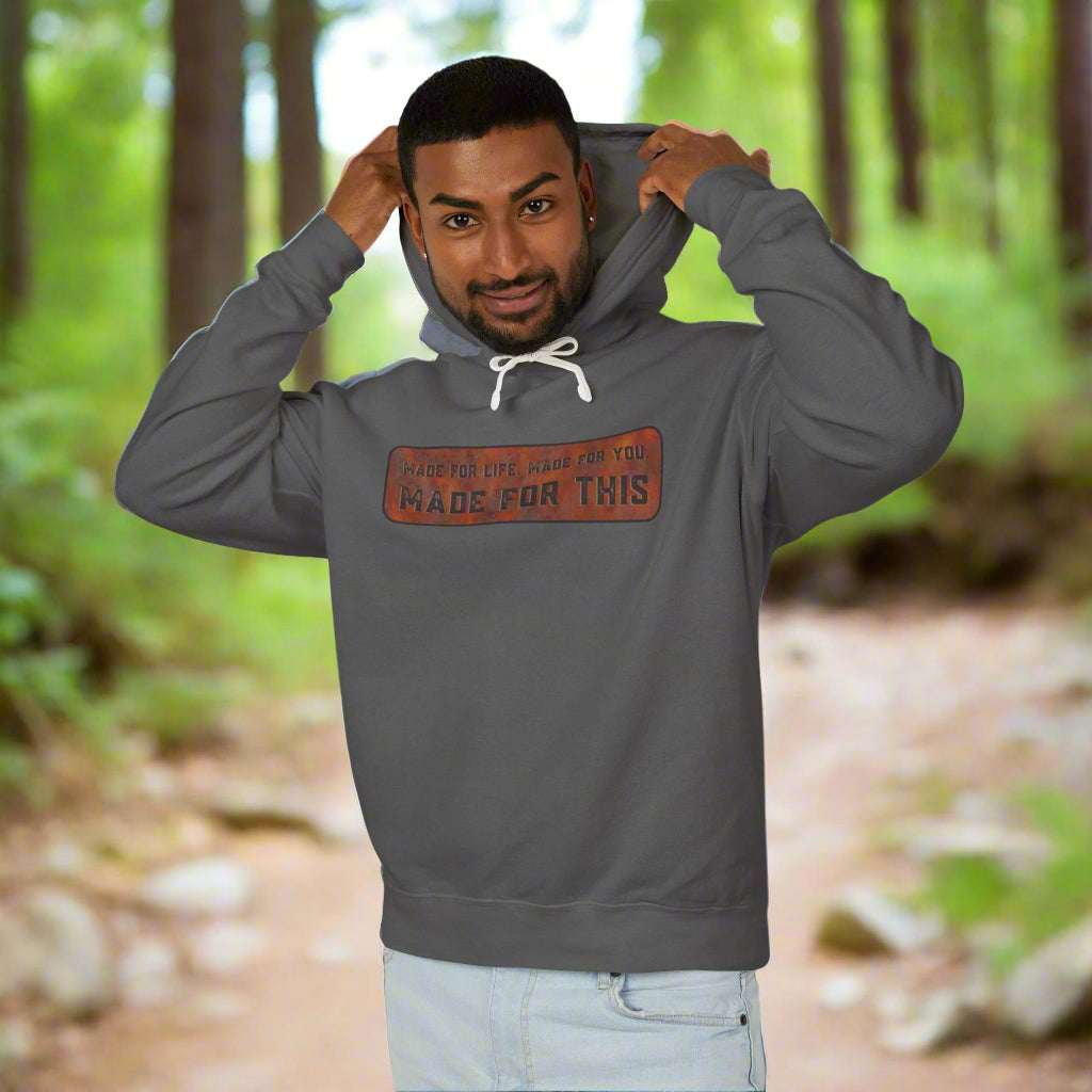 Man wearing a gray hoodie with text on a white background